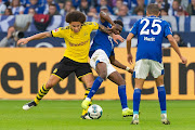 Axel Witsel of Borussia Dortmund and Rabbi Matondo of FC Schalke 04 battle for the ball during the Bundesliga match between FC Schalke 04 and Borussia Dortmund at Veltins-Arena on October 26, 2019 in Gelsenkirchen, Germany. 