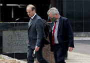 Former Tongaat Hulett CEO Peter Staude, right, leaving the Durban magistrate's court on Thursday, where he has been implicated in a R1.5bn fraud matter.