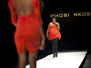 A 'plus sized' model walks down the catwalk. File Photo.