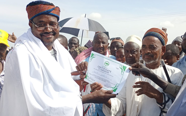 The Matadedha Orma council of elders chairman Omar Wario issues the certificate to Bura MP Ali Wario as the community's sole candidate to contest for the Tana River governor seat.