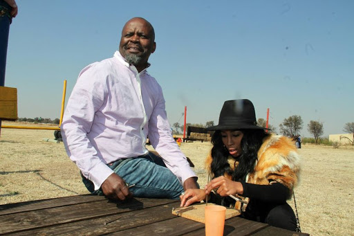 Actor Patrick Shai with Talk show host and actress Khanyi Mbau playing mind games at the Stonehenge Africa in Parys. The day will be filled with some pampering and adrenaline adventure in celebration of Father's Day. Pic: Bafana Mahlangu. Â© Sowetan