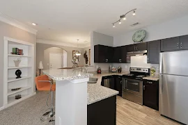 Kitchen bar top with granite countertops overlooking kitchen