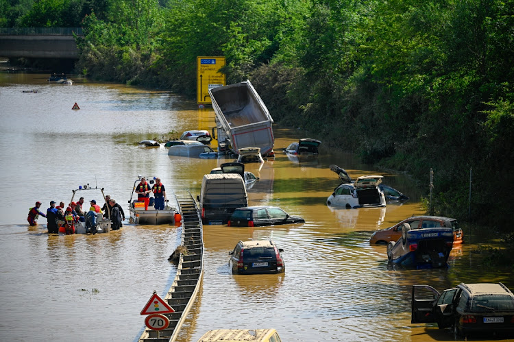 Search and rescue teams are seen on a flooded and damaged part of the highway (A1) on July 17, 2021 in Erftstadt, Germany. The death toll in western Europe rose to 150 after record rainfall this week caused rivers to burst their banks, resulting in widespread devastation in the region.