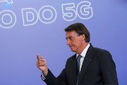 Brazil's President Jair Bolsonaro attends a 5G auction contract signing ceremony at the Planalto Palace in Brasilia, Brazil December 7, 2021. 