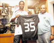 20100131VNH.   Midfielder Isaac Chansa  joined Orlando Pirates pose for the photo with  the club's  administration executive, Floyd 