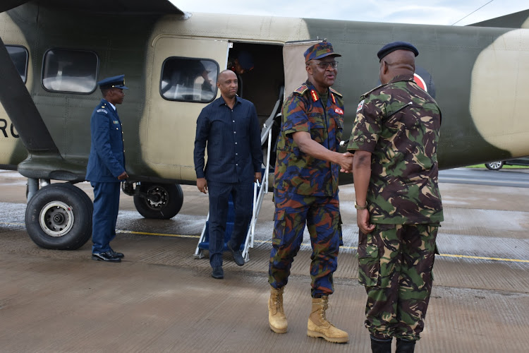 Chief of Defence Forces General Francis Ogolla and Isiolo Governor Abdi Hassan Guyo arrive at Isiolo Airport for the tree plant exercise at Waso Primary School , Isiolo on November 13, 2023