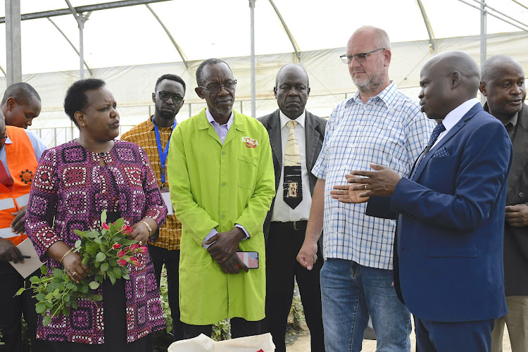 The CS for Labor Florence Bore (L) joins senior government officers when she toured Naivasha based Van-Den-Berg flower farm during a familiarization tour on 2/12/22. She said that the government would intervene over the high prices of airfreight charges that had affected horticultural farmers.