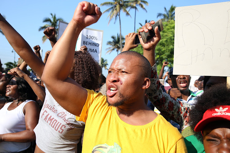 Supporters of former president Jacob Zuma march to the Durban High Court on April 6 2018 as he makes his first court appearance.