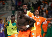 Oumar Diakite celebrates scoring Ivory Coast's extra-time winner with teammates in their Africa Cup of Nations quarterfinal victory against Mali at Stade de la Paix in Bouake, Ivory Coast on Saturday night.