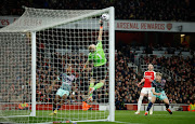 Brentford's Nathan Collins has his shot saved by Arsenal's Aaron Ramsdale in the Premier League match at Emirates Stadium in London on Saturday night.