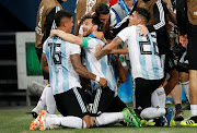 Argentina's Marcos Rojo celebrates scoring their second goal with Lionel Messi and teammates. 