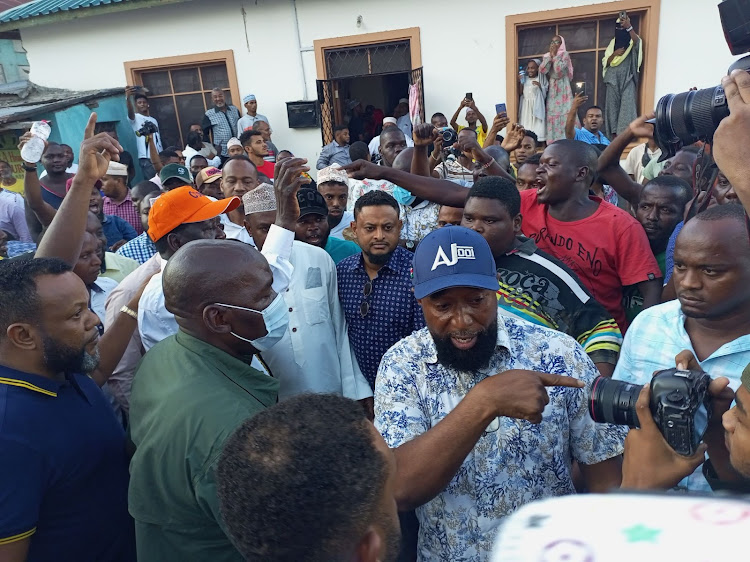 Mombasa businessman Abu Joho leads the way as Raila Odinga leaves Mvita MP Abdulswamad Nassir's family home at Seven up on Monday.