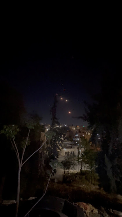 Objects are seen in the sky over Amman after Iran launched drones towards Israel, in Amman, Jordan on April 14 2024, in this screen grab obtained from a social media video.