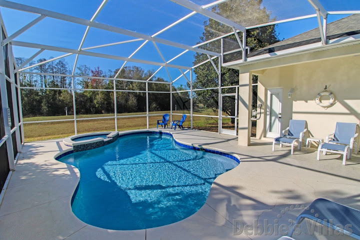 Sun-drenched pool area of this Highlands Reserve villa in Davenport