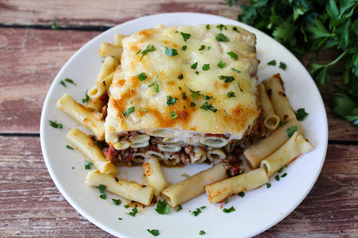 A slice of Baked Ziti With Italian Sausage and Eggplant on a plate.