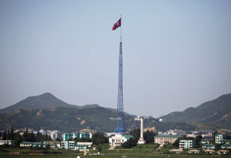 A North Korean flag flutters on top of a tower at the propaganda village of Gijungdong in North Korea, in this picture taken near the truce village of Panmunjom, South Korea, August 26, 2017.