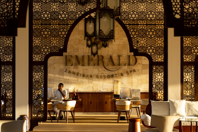 Arabian-inspired screens in the airy reception area.