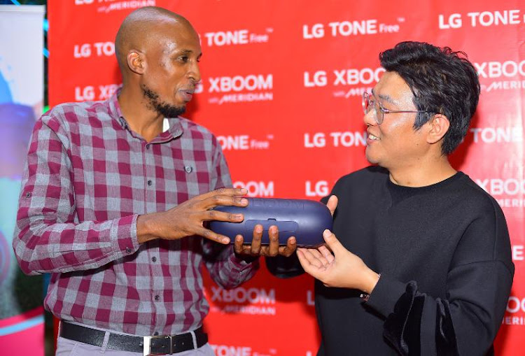 LG Electronics East Africa Home Entertainment Product Manager Younghun Kim (right) engages Audio Visual Ass. Product Manager John Gitau during the launch of the LG XBOOM Go PL, the latest portable bluetooth speaker models with advanced portability, connectivity options and excellent audio quality.