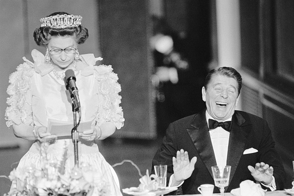 President Reagan laughs following a joke by Queen Elizabeth, who commented on the lousy California weather she has experienced since her arrival to the States. Picture: GETTY IMAGES/BETTMANN