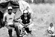 IN THE LURCH: Reuben Mamabolo and Samantha Tessling with their children Simon and Ashley after their shack in Midrand was demolished on Friday. 16/12/08. Pic. Peter Mogaki. © Sowetan.