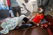 Fourteen-year-old Adan Muez is helped to sit up in his bed at Adigrat General Hospital in the town of Adigrat, Tigray region, Ethiopia. File photo 