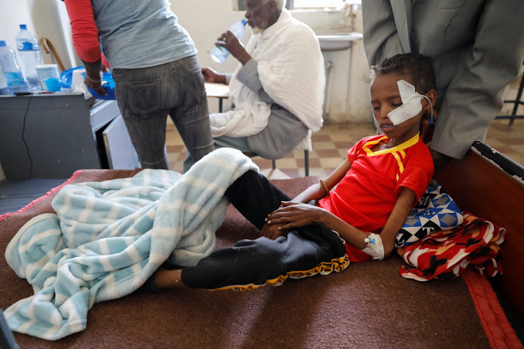 Fourteen-year-old Adan Muez is helped to sit up in his bed at Adigrat General Hospital in the town of Adigrat, Tigray region, Ethiopia. File photo