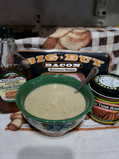 Soup in a bowl with maple syrup bacon and ham base