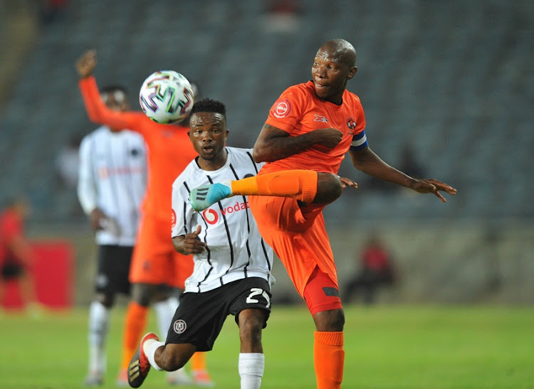 Jabulani Maluleke of Polokwane City challenged by Paseka Mako of Orlando Pirates during the Absa Premiership match between Orlando Pirates and Polokwane City on 26 November 2019 at Orlando Stadium.