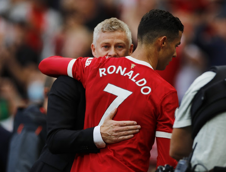 Manchester United's Cristiano Ronaldo and manager Ole Gunnar Solskjaer embrace after the win against Newcastle at Old Trafford, Manchester, on September 11, 2021