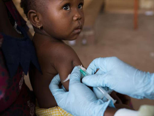 A child gets the RTS,S malaria vaccine during the clinical trials.