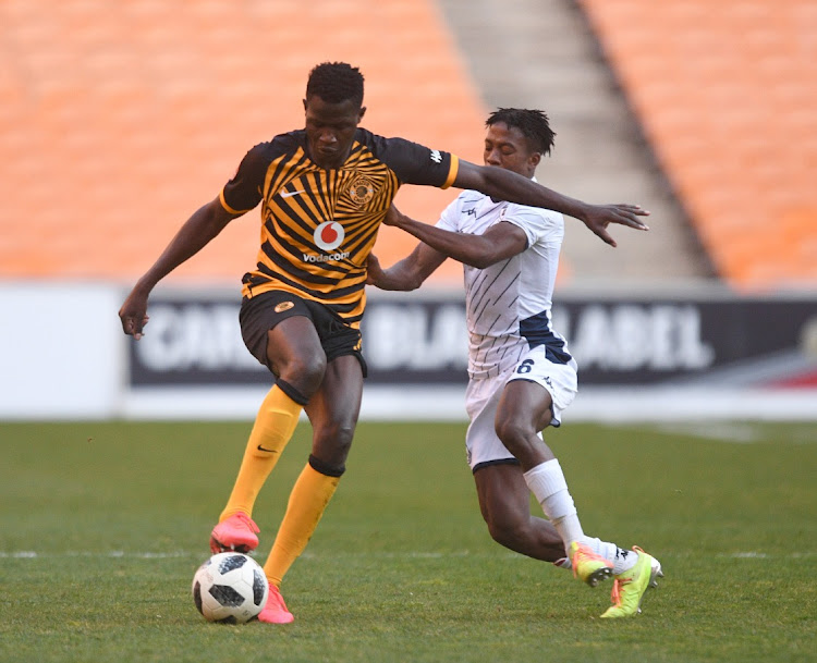 Kgaogelo Sekgota of now defunct Bidvest Wits challenges Anthony Agay of Kaizer Chiefs.