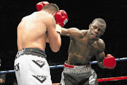 DUCK
      : Steve Cunningham, left, throws a punch a Sebastiaan Rothmann during their cruiserweight clash at the Carnival City Casino in Brakpan, Gauteng.
    
      Photo: Gallo Images