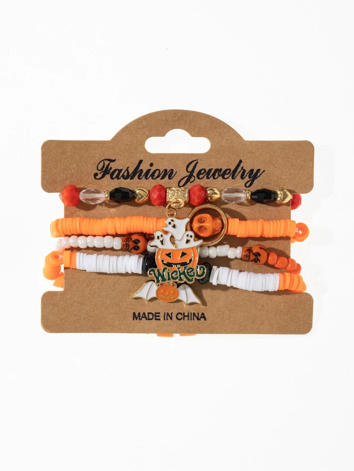 Bracelet de fête fait main en fil de pâte polymère avec chauve-souris, araignée et citrouille, idéal pour Halloween et les célébrations.