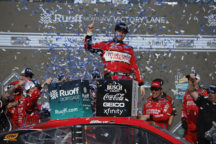 Chase Briscoe, driver of the #14 Mahindra Tractors Ford celebrates in victory lane after winning the the Ruoff Mortgage 500 at Phoenix Raceway on March 13 2022 in Avondale, Arizona.