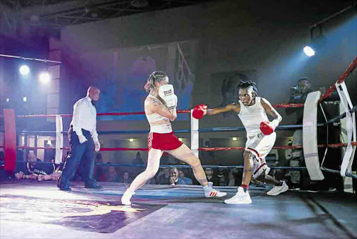 Bukiwe ‘Anaconda’ Nonina launches a right hook at former eight-time world champion, Germany's Alesia ‘Tigress’ Graf, at the OR Tambo Hall, in Khayelitsha. Nonina, from Dutywa, in the Eastern Cape, beat Graf over 10 rounds via a unanimous points decision during the ‘Fight for Hope’ charity boxing event for the vacant World Boxing Federation world bantamweight titlePicture: CHRIS DE BEER