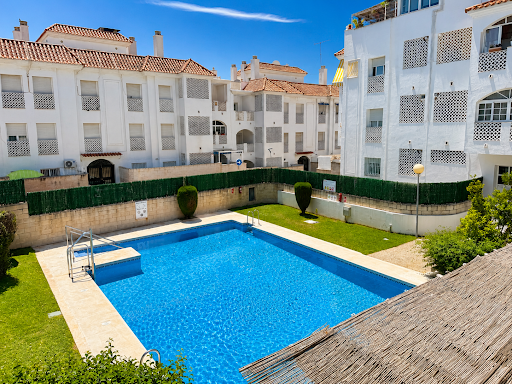 Buy this luxury property in Municipality of Torremolinos (Spain) - Outdoor swimming pool and residential building