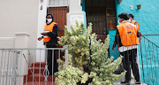 Health workers going door-to-door to ask residents standard questions​ during their Community-based Covid-19 screening and testing in Bo-Kaap, Cape Town on April 7 2020. 
