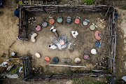 An aerial view of the kraal at Dyalvane's family homestead, the focal point of the weekend activities during which family members and honoured guests sat upon the sculptural ceramic chairs he's created for his latest exhibition. In recognition of their ceremonial origins, the sculptures will be arranged in a circle when they are shown at Southern Guild gallery in Cape Town.