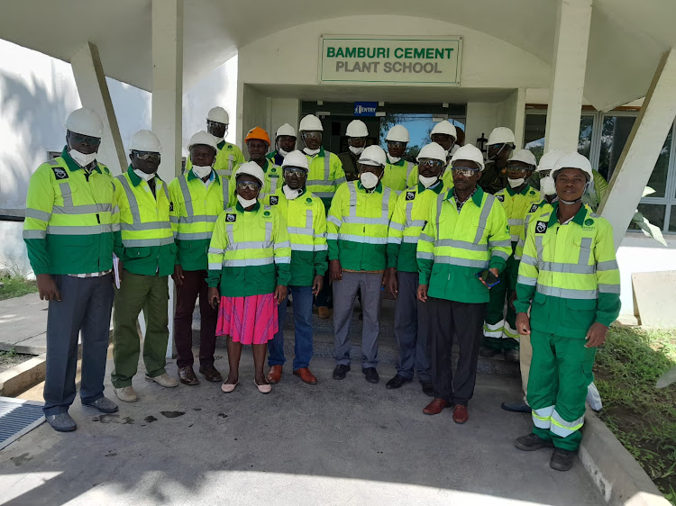 Kakamega County officials, Mukumu girls parents representatives, the school deputy principal and Bamburi Cement officials during the witnessing of the incineration process in Mombasa