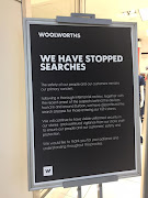 A notice outside the Woolworths store in Durban's Musgrave Centre notifying shoppers that bag searches have been discontinued.