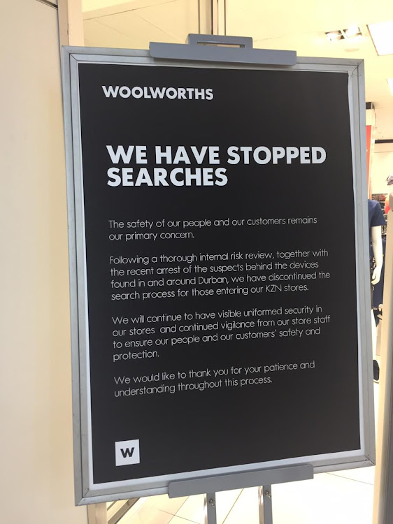 A notice outside the Woolworths store in Durban's Musgrave Centre notifying shoppers that bag searches have been discontinued.