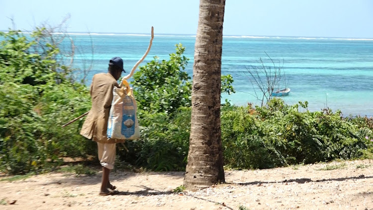 A local fisherman in Mayungu village Malindi subcounty of Kilifi county prepares to go fishing from the Indian ocean.