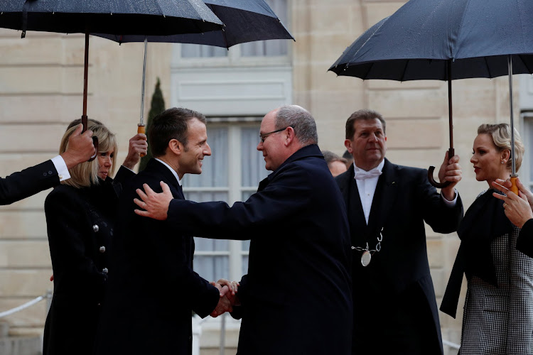 French president Emmanuel Macron and his wife Brigitte welcome prince Albert II of Monaco and his wife princess Charlene (R) at the Elysee Palace as part of the commemoration ceremony for Armistice Day, 100 years after the end of the First World War, in Paris on Sunday.