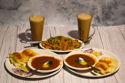 2 Pav Bhaji + 1 Veg. Pulav + 2 Beverages