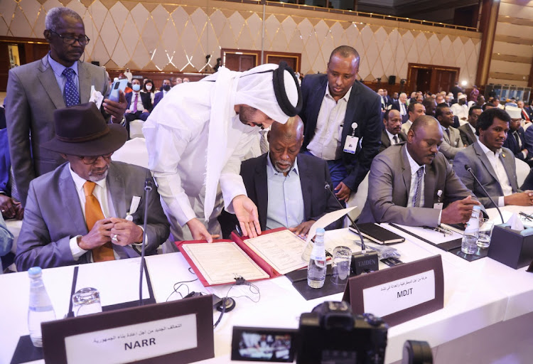 Officials attend a signing agreement for a national dialogue with Chad's transitional military authorities and rebels at Sheraton Hotel in Doha, Qatar August 8, 2022.