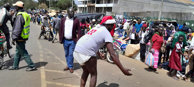 Musician William Getumbe wearing diappers during the street campaigns in Eldoret on December 23rd 2022