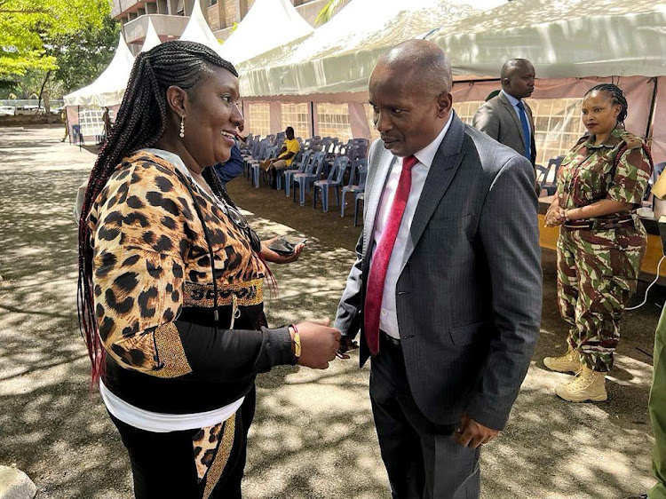 Interior CS Kithure Kindiki interacting with a Kenyan at Nyayo House when he made an impromptu visit on October 30, 2023.