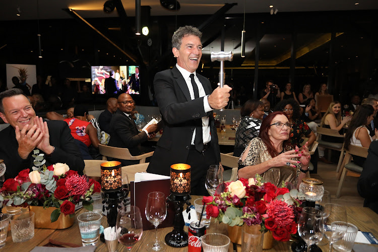 Antonio Banderas brandishes the silver gavel gifted to him by South African auctioneer Joff van Reenen after a charity auction hosted by Banderas this week raised some R1.2 million for Nkosi’s Haven that supports mothers and children affected by HIV/Aids.