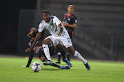 Riyaaz Ismail of Maritzburg United  and Thamsanqa Gabuza of SuperSport United during the DStv Premiership match between SuperSport United and Maritzburg United at Lucas Masterpieces Moripe Stadium.