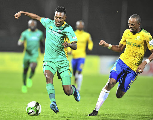 Richard Matloga of Baroka, left, is challenged by Tiyani Mabunda of Mamelodi Sundowns during their PSL clash at Lucas Moripe Stadium, Pretoria.